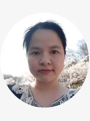 A young woman with dark hair smiling