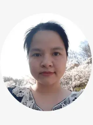 A young woman with dark hair smiling