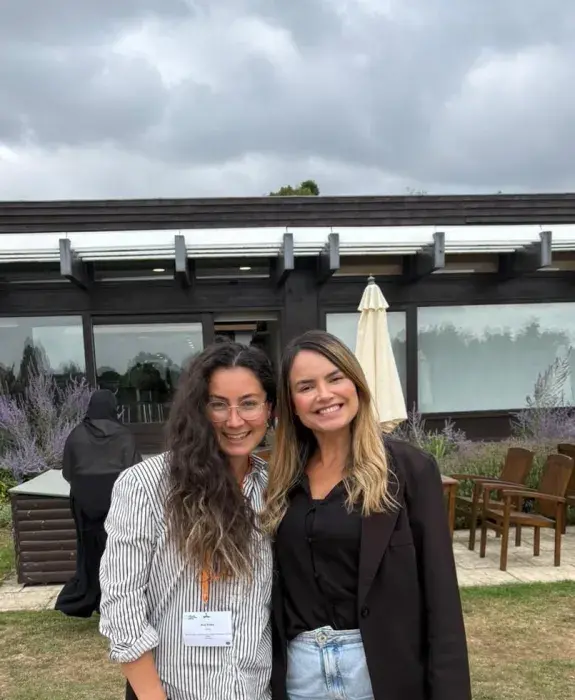Image of two women stood together smiling