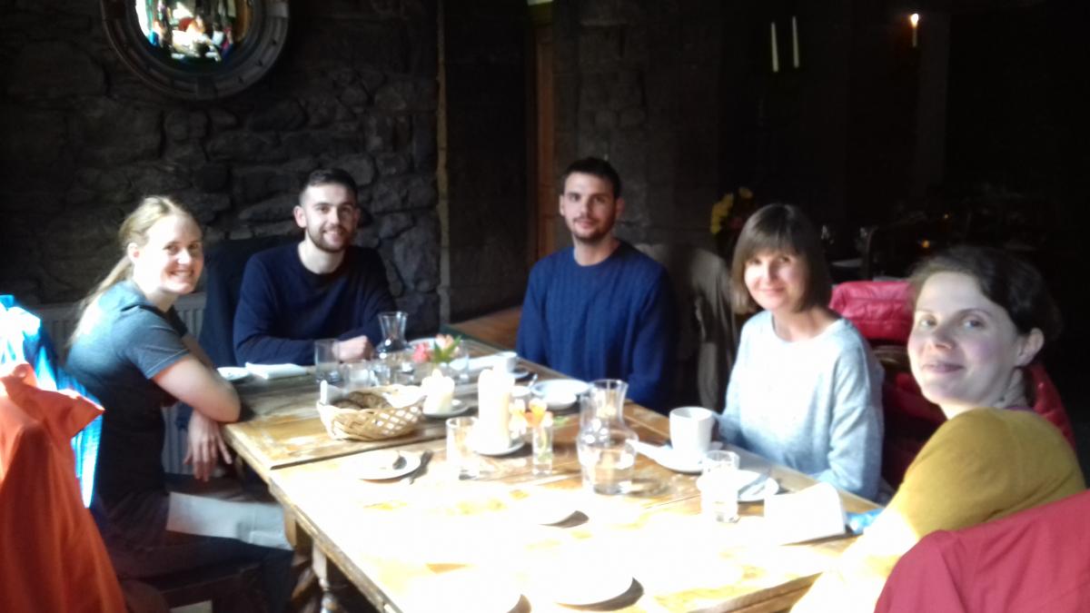 Members of the lab sit round a restaurant table