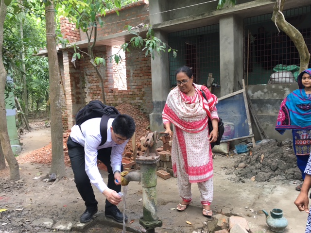 Dr Baojun Wang collecting water samples in Bangladesh