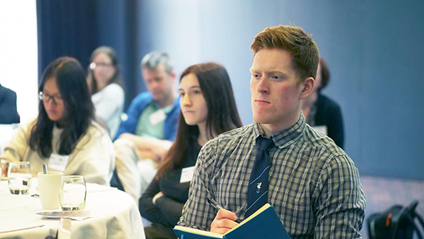 Students sit in a conference room in Dundee