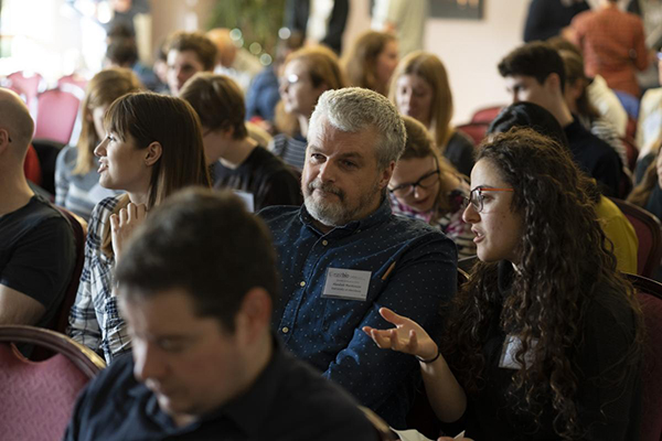 Students and supervisors watching a presentation