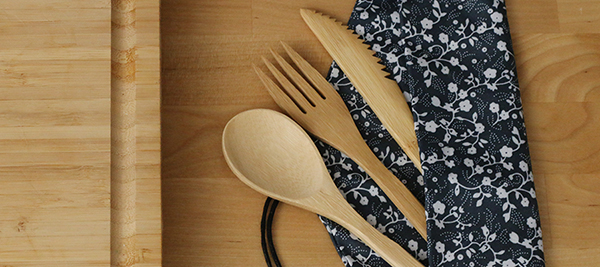 Photo of wooden cutlery in a cloth pouch