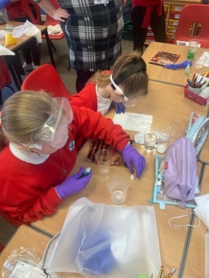 image of a child in red with safety glasses on