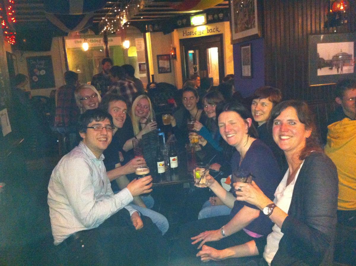 Photo of the lab group sitting with drinks 