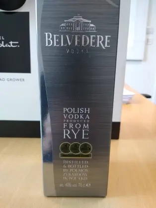 Photo of a Belvedere vodka bottle box and a hotel chocolat box behind it