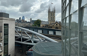 Photo of a view from an office window, with a church and office buildings