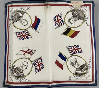 A commemorative handkerchief from WWI, with images of generals and flags.