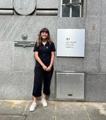 Photo of Annis outside a UK Health Security Agency building 