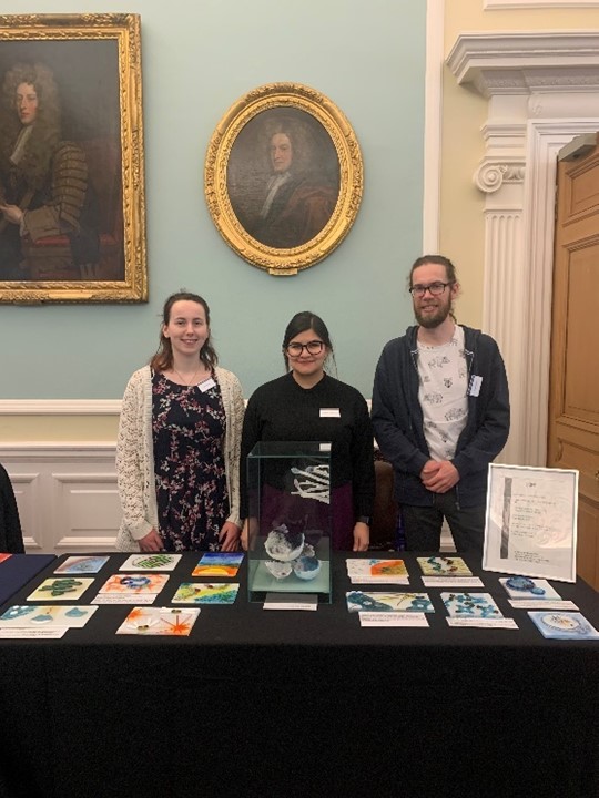 3 members of the public engagement team with their stall at the Royal College of suegeons